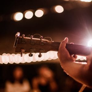 Musicians playing guitar at music festivals, lights, music, concerts, mini concerts. music festivals