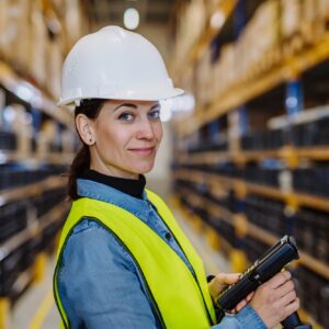 Warehouse female worker checking up stuff in a warehouse.