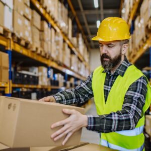 Warehouse worker stocking goods in a warehouse.